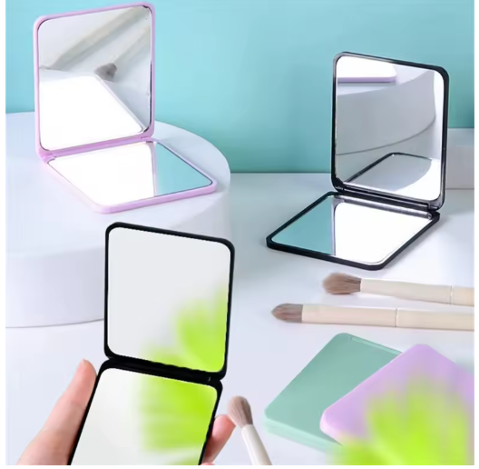 Espejo de Maquillaje Plegable Portátil Doble Cara – Elegancia Compacta para tu Tocador o Bolso